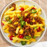 The Return Of Chili Cheese Fries · Crinkly cut fries cooked until golden brown and garnished with season salt, melted cheddar c...