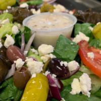 Greek Salad · Lettuce, tomato, onions, black olives, pepperoncini, green bell pepper, stuffed grape leaves...
