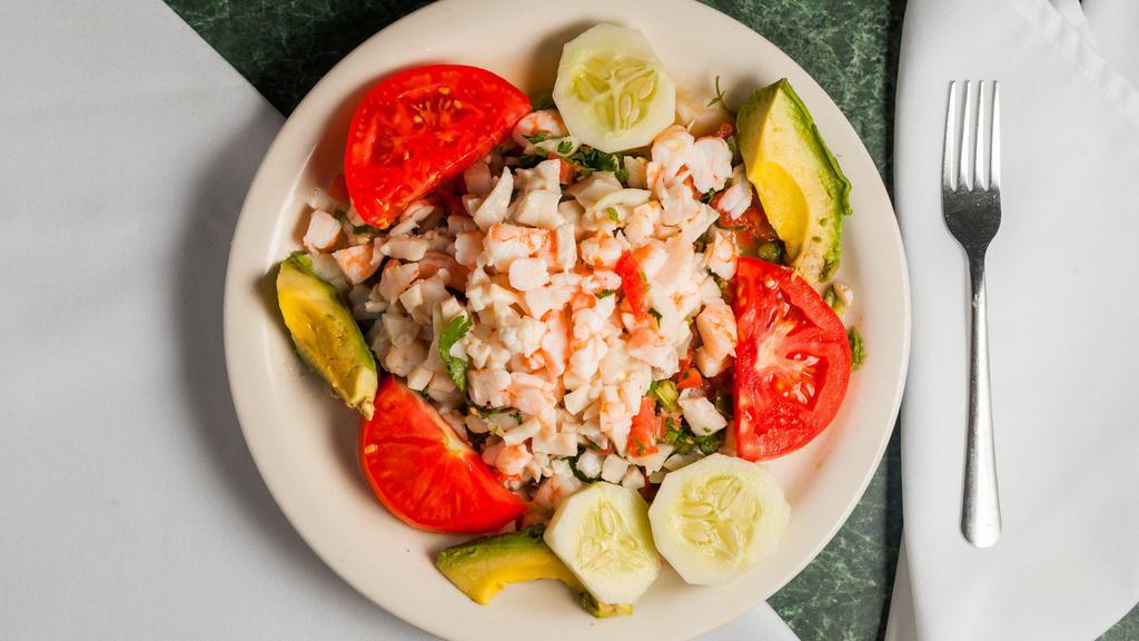 Ceviche Shrimp Only · Fresh shrimp marinated and cooked in lime juice with chopped onions, tomatoes, cilantro, peppers, and a slice of avocado, tomatoes, cucumbers and lime, drizzled with olive oil.