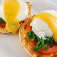 Traditional Eggs Benedict · Served with hash browns and biscuits. Poached eggs on toasted English muffin with hollandais...