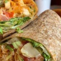 Buffalo Chicken Wrap · Crispy breaded chicken tossed in spicy Buffalo sauce with romaine lettuce, tomato, and blue ...