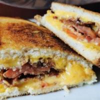 Ultimate Grilled Cheese Sandwich · American cheese on panini. Comes with side.