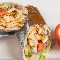 Chicken Gyro Sandwich · Marinated chicken with special spices, lettuce, tomatoes, onions, tahini sauce rolled in up ...