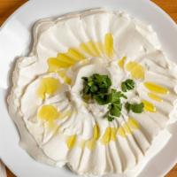 Labne (Yogurt) · Homemade condensed yogurt served with sumac, olive oil and pita bread.