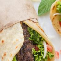 Beef Gyro Sandwich · Beef or lamb topped with lettuce, tomatoes, onion, tzatziki sauce, tombik pita bread.