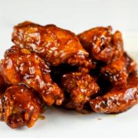 12 Classic Bone-In Wings · 12 Classic bone-in chicken wings tossed with wing sauce and served with ranch or blue cheese...