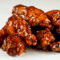 8 Classic Bone-In Wings · 8 Classic bone-in chicken wings tossed with wing sauce and served with ranch or blue cheese ...