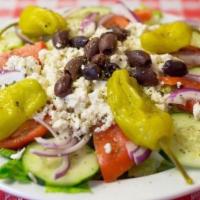 Greek Salad · Romaine lettuce, tomatoes, cucumbers, onions, black and kalamata olives, and pepperonccini p...