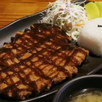 Don Katsu · Pork cutlet, sauce on side, rice, salad.