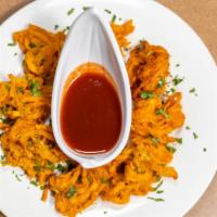 Pakora · Fresh sliced vegetables prepared with chick-pea flour, whole coriander, onions and other spi...