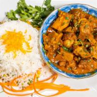 Goat Curry · Goat meat sautéed in India’s favorite yellow curry sauce cooked with grilled onions, turmeri...