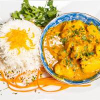 Chicken Curry · Chicken meat sautéed in India’s favorite yellow curry sauce cooked with grilled onions, turm...