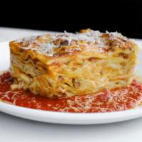 Classic Lasagna · Fresh handmade lasagna sheet pasta, homemade Bolognese sauce, besciamel, Parmigiano cheese.