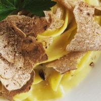 Truffle Fettuccine (Vegetarian) · Fresh handmade fettuccine pasta with Italian black truffle butter sauce and fresh Italian bl...