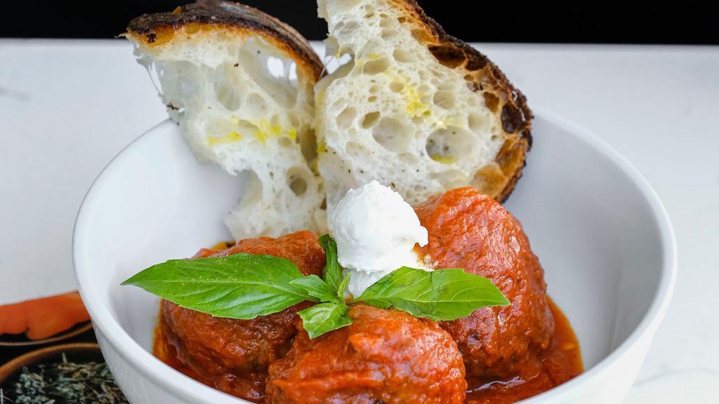 Italian Meatballs · Three homemade meatballs, San Marzano tomato sauce, fresh ricotta cheese, fresh basil, country bread.