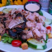 Smokehouse Salad · Large house salad with any choice of 2 of the following pulled pork, smoked turkey, or pulle...