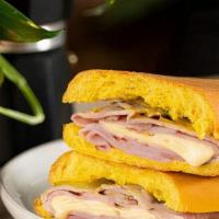 Midnight/Medianoche Sandwich · Ham, Pork, Swiss Cheese, Pickles, and Mustard on Sweet Bread/Jamón, Cerdo, Queso Suizo, Pepi...
