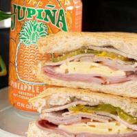 Cuban/Cubano Sandwich · Ham, Pork, Swiss Cheese, Pickles, and Mustard on Cuban Bread/Jamón, Cerdo, Queso Suizo, Pepi...