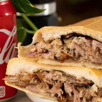 Pork/Lechon Sandwich · Onions and Mojo on Cuban Bread/Cebollas y Mojo en Pan Cubano