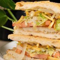 Chicken/Pollo Sandwich · Potato Sticks, Onions, Lettuce and Tomatoes on Cuban Bread/Papitas, Cebollas, Lechuga y Toma...