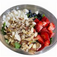 Sanatos Salad · Spinach, arugula, strawberries, blueberries, almonds, goat cheese, honey and balsamic dressi...
