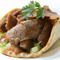 Gyro (Doner Kabab) · The shaved roast blend of thinly sliced beef and lamb served in pita bread with lettuce, tom...