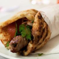 Lamb Kabab · Charbroiled ground lamb mixed with onion and special spices served in a pita bread with lett...