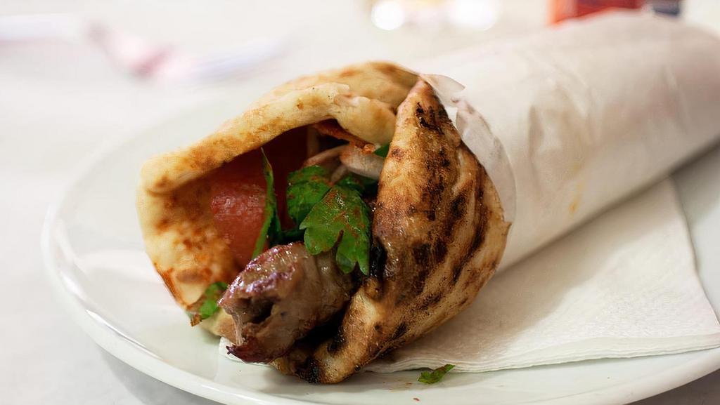 Lamb Kabab · Charbroiled ground lamb mixed with onion and special spices served in a pita bread with lettuce, tomatoes, onion, pickles and tahini sauce.
