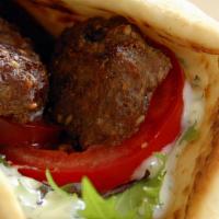 Shish Kabab · Charbroiled marinated lean cut beef served in pita bread with lettuce, tomato, onion, pickle...