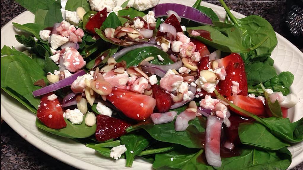 Spinach And Strawberry · Fresh spinach with strawberries, sliced almonds, red onions, feta cheese, and raspberry vinaigrette.