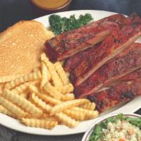 Smokin' Spare Ribs · Tender, meaty spare ribs basted in our famous sauce and slow smoked.