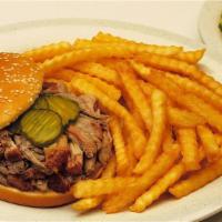 Carolina Pulled Pork · A melt in your mouth sandwich. Tender Carolina pulled pork piled high and served with pickles.