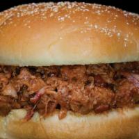 Sloppy Woody · A tangy combination of woody’s secret sauce and bbq pork piled high. consumer advisory consu...