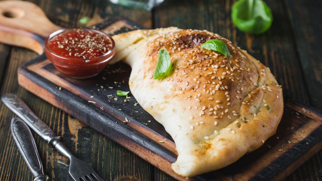Meatball Calzone · Mouthwatering 16 inch calzone stuffed with Meatballs, and Ricotta and Mozzarella Cheese.
