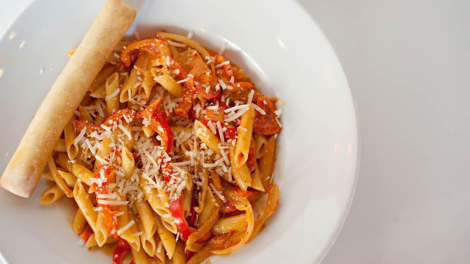 Southwest Chipotle · Penne pasta in a delicious red pepper cream sauce tossed with fresh red bell peppers, Chipotle peppers and mild onions. Garnished with grated Parmesan cheese. (Spicy)