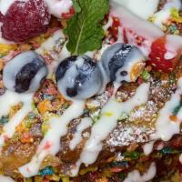 Fruity Pebble French Toast · Texas size toast dipped in a warm cinnamon milk cooked with our crunchy fruity pebble cereal...