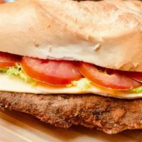 Beef Milanesa Sandwich · Topped with lettuce and tomato served with french fries or house salad