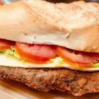 Chicken Milanesa Sandwich · Topped with lettuce and tomato served with french fries or house salad