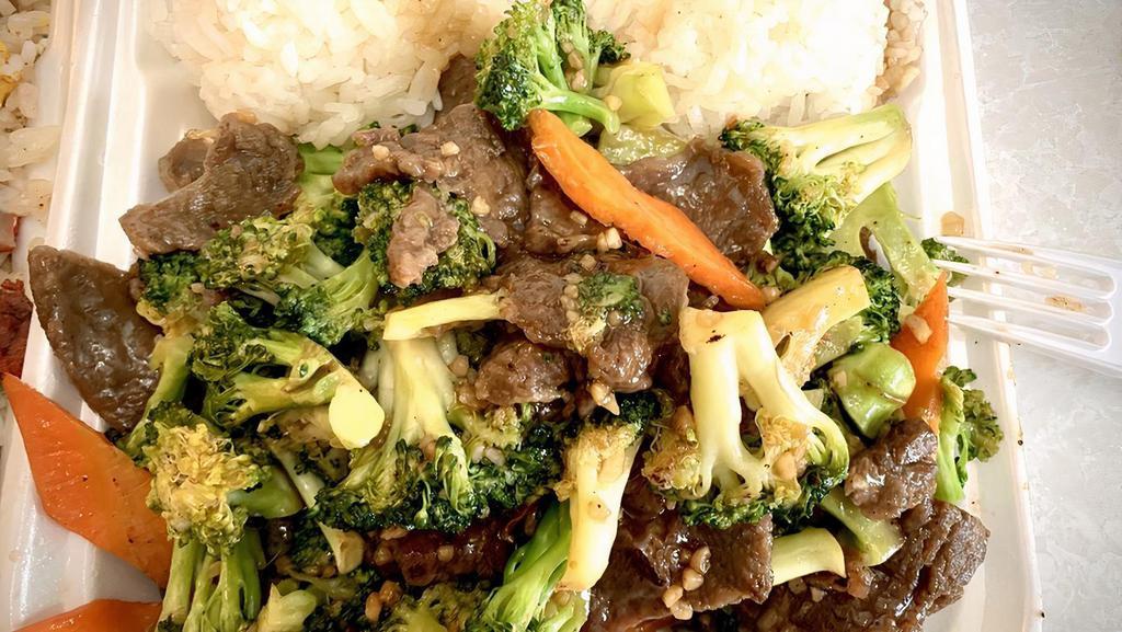 Beef With Broccoli · Served with vegetable fried rice or white rice and egg roll.