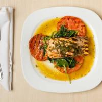Salmon With Rosemary · Fresh filet of salmon grilled served over spinach and grilled tomatoes.