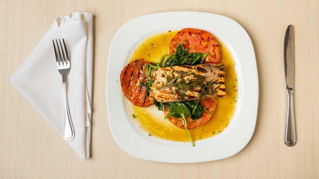 Salmon With Rosemary · Fresh filet of salmon grilled served over spinach and grilled tomatoes.