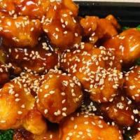 Sesame Chicken · Served with fried rice or white rice.