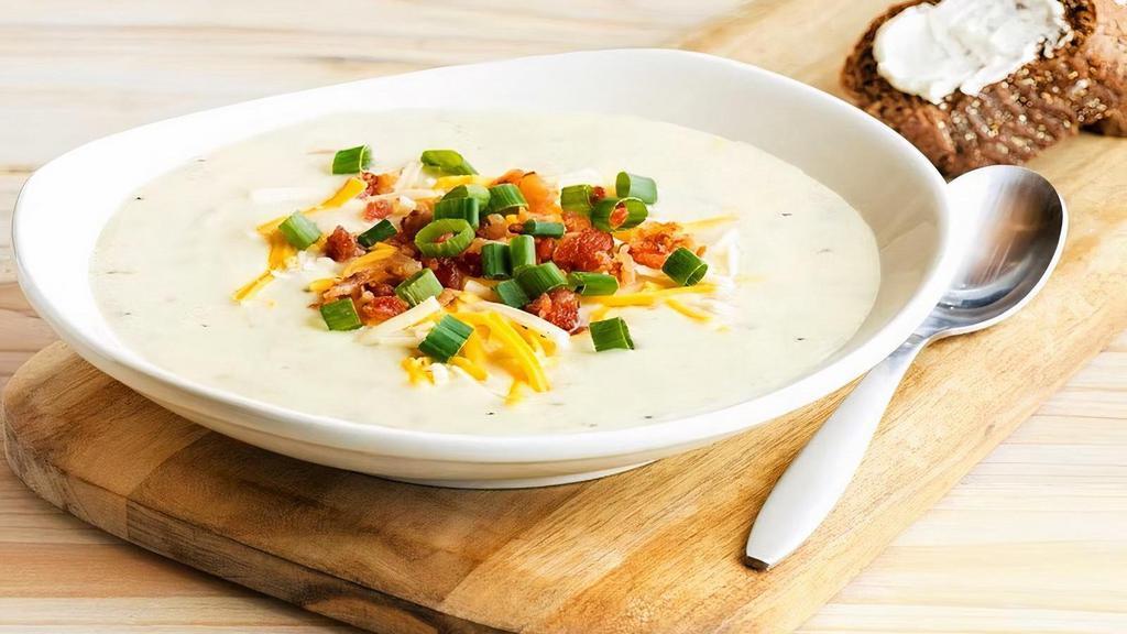 Baked Potato Soup · Topped with melted cheese, bacon and green onions.