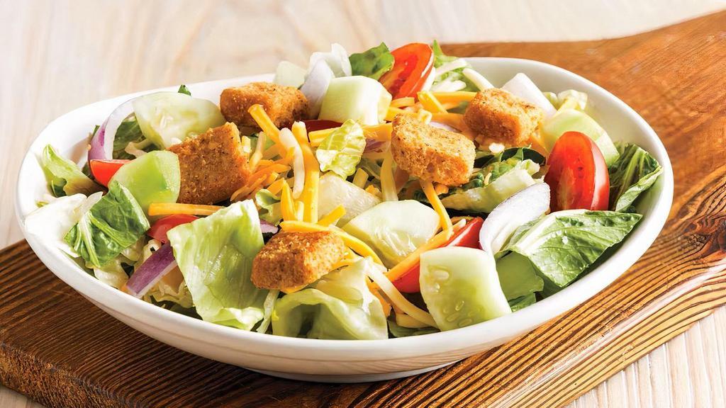 House Side Salad · Mixed lettuce with Napa cabbage, dressing of choice, cucumbers, Monterey Jack and Cheddar cheese, tomatoes, red onions and homemade croutons. (180-360 calories)