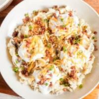 Loaded Mashed Potatoes · Topped with sour cream, bacon, green onions, Monterey Jack and Cheddar cheese