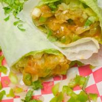 Vegetable Burrito · Bell peppers, onions, tomatoes, cilantro, avocado, lettuce and cheese.