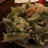 Classic Caesar · Romaine hearts, croutons, and parmesan cheese tossed in creamy Caesar dressing.