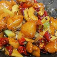 Kung Po Chicken / 宮保雞 · Chicken tossed with sweet garlic and dry chili sauce.