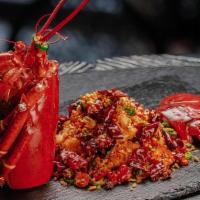 Sichuan-Style Lobster / 川式香辣爆炒龍蝦 · Wok-tossed with chilli, black beans and dried garlic.