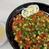 Garbanzo Salad · Israeli salad with garbanzo beans, hard, boiled egg.